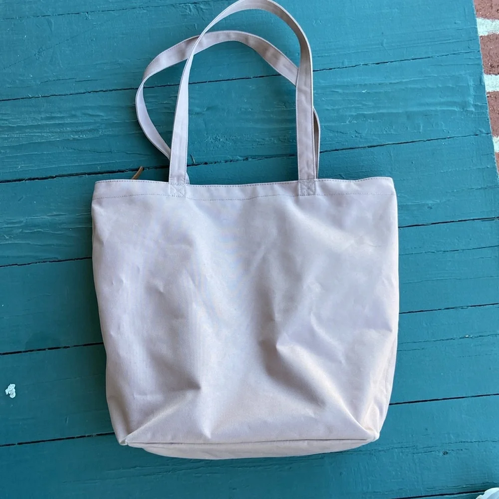Herschel Supply Co. rose colored‎ canvas tote bag.